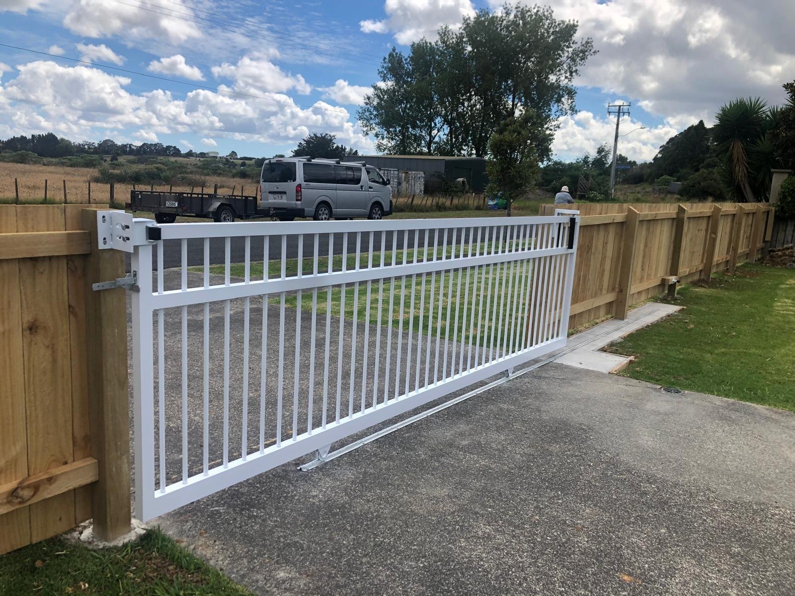 White Sliding Gate and Timber Fence